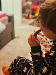 child using aromatherapy inhaler